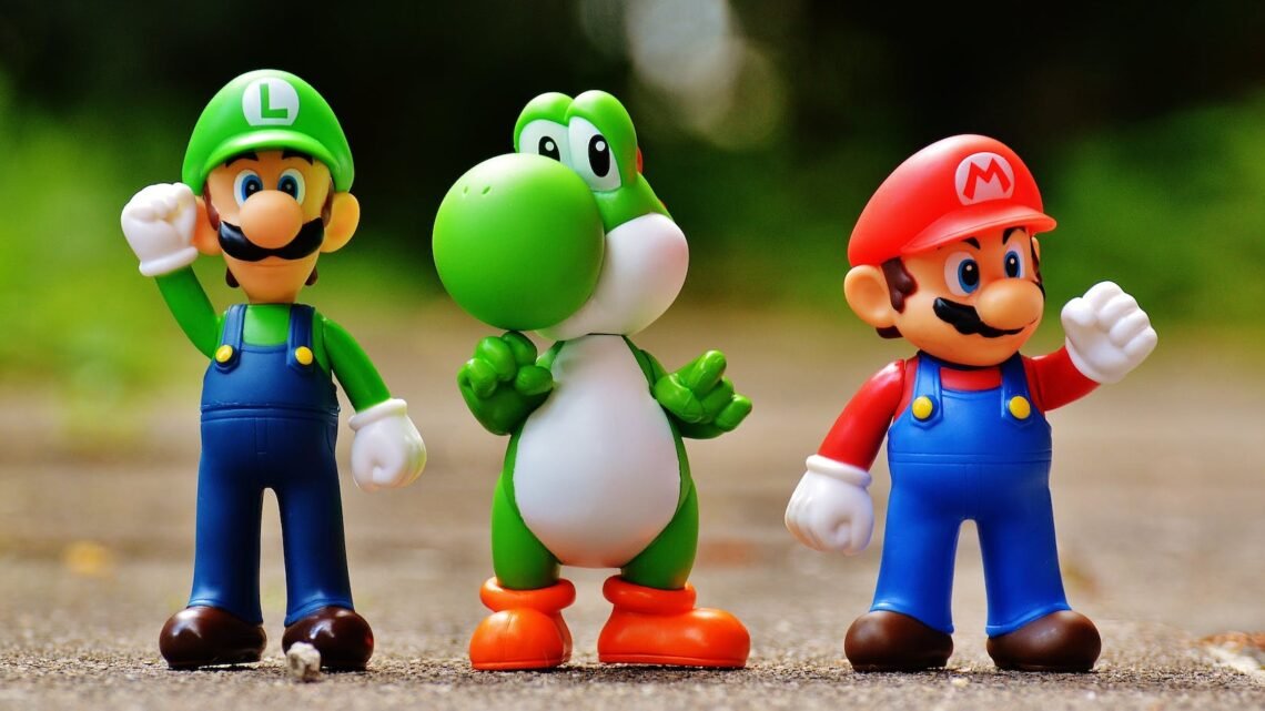 focus photo of super mario luigi and yoshi figurines